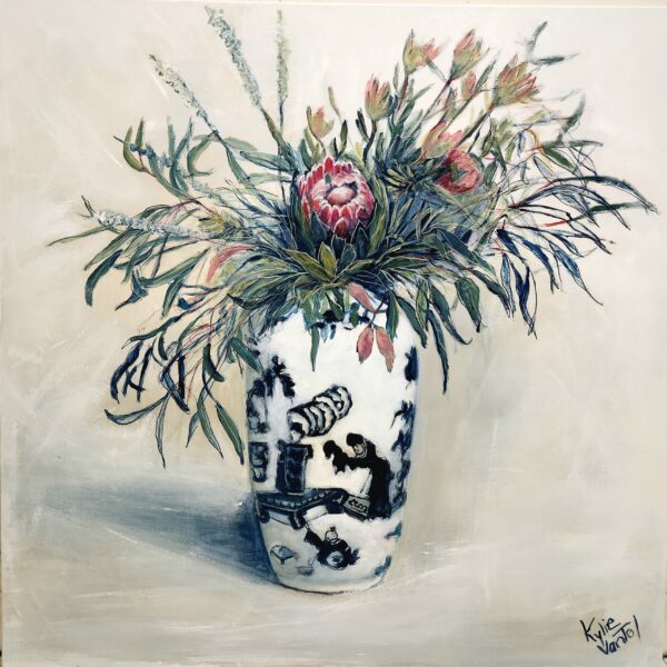 Native flowers in blue and white vase